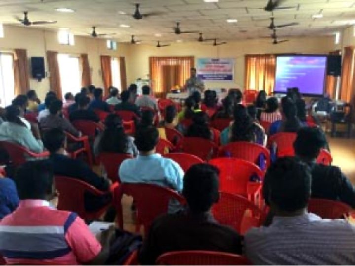 Audience in red chairs attending a life support awareness talk