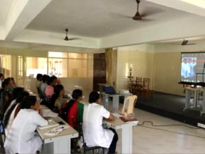Students in a classroom watching a presentation